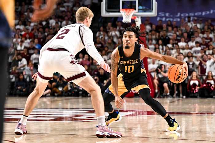 Nov 6, 2023; College Station, Texas, USA; Texas A&M Commerce guard Alonzo Dodd (10) controls the ball as Texas A&M Aggies guard Hayden Hefner (2) defends during the first half at Reed Arena.